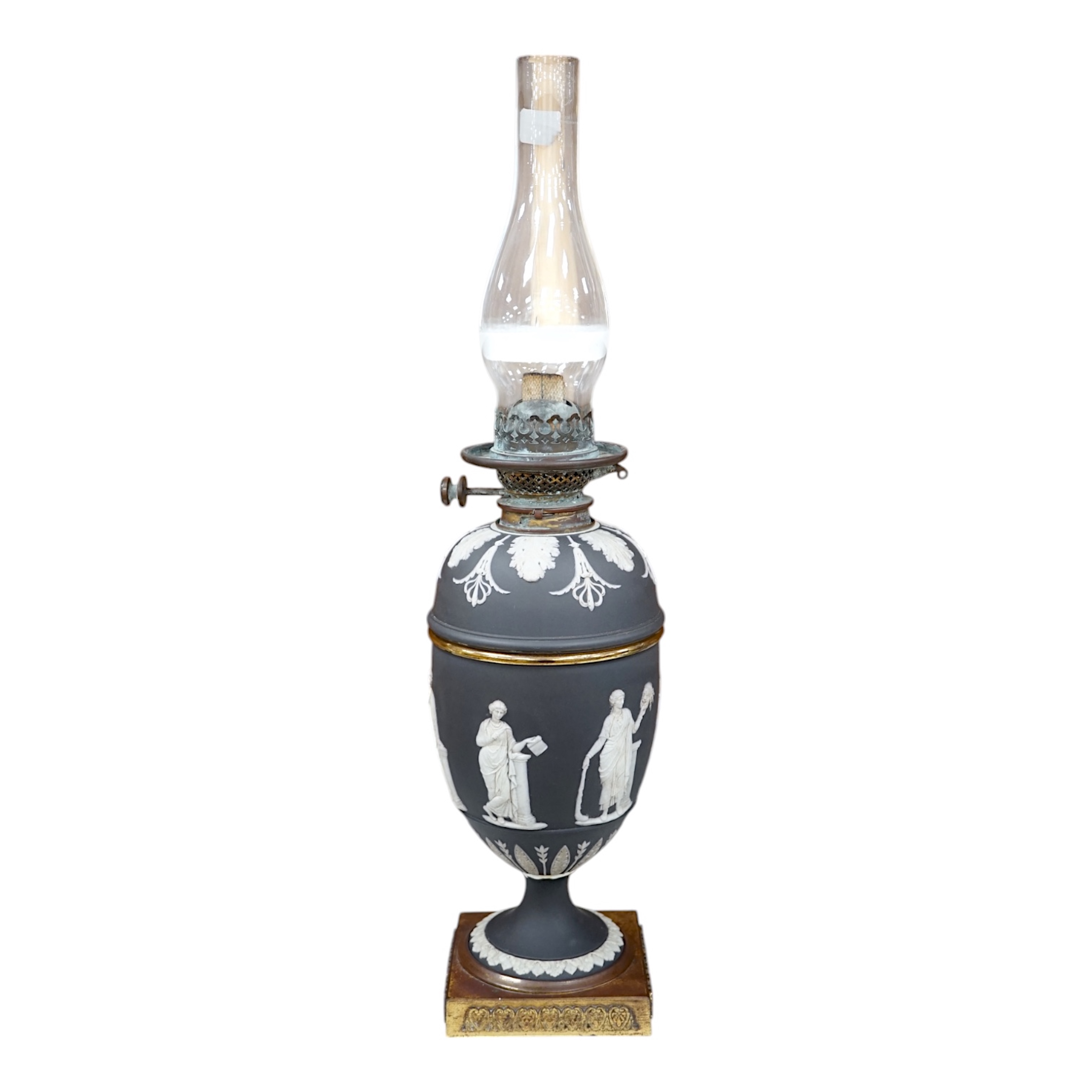 A Victorian black jasper oil lamp and reservoir, 65cm high. Condition - repaired at stem